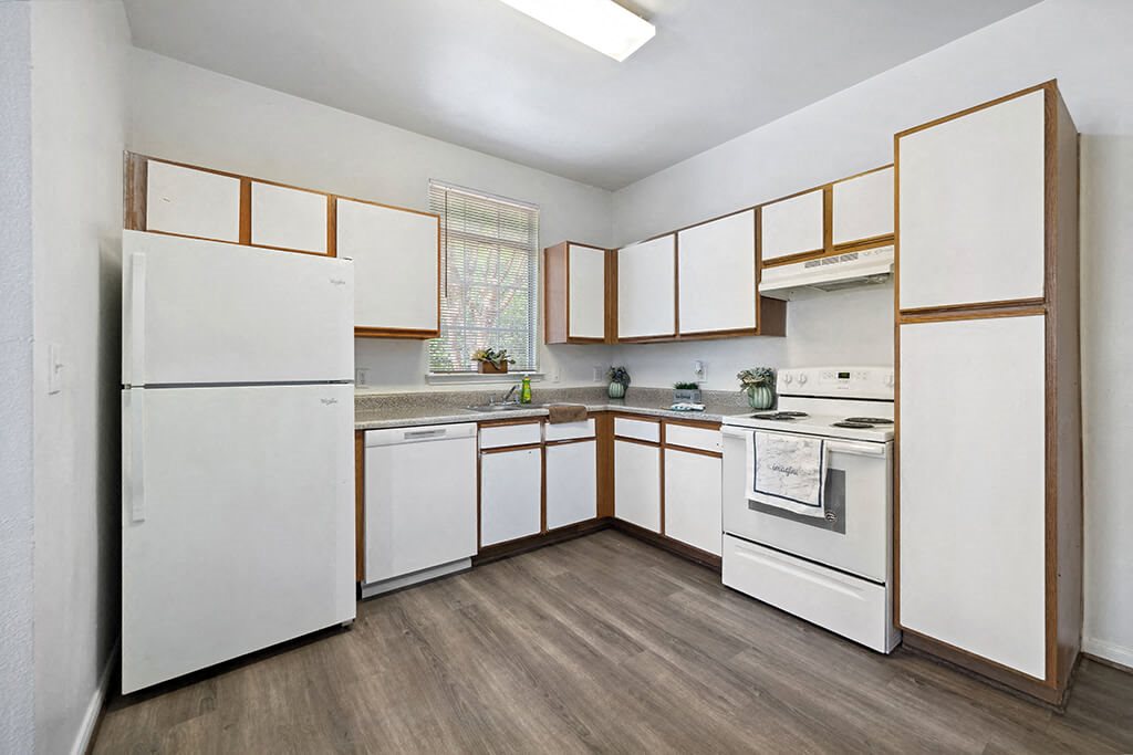 Kitchen with appliances at Fountains at Tidwell and The Enclave in Houston TX